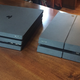 On the right, an original PS4. On the left, the Pro. The footprint is basically the same, the Pro is just a little taller.